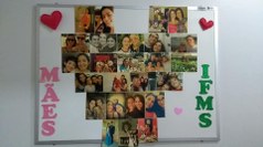 Mural de fotos com imagens das servidoras e seus filhos.